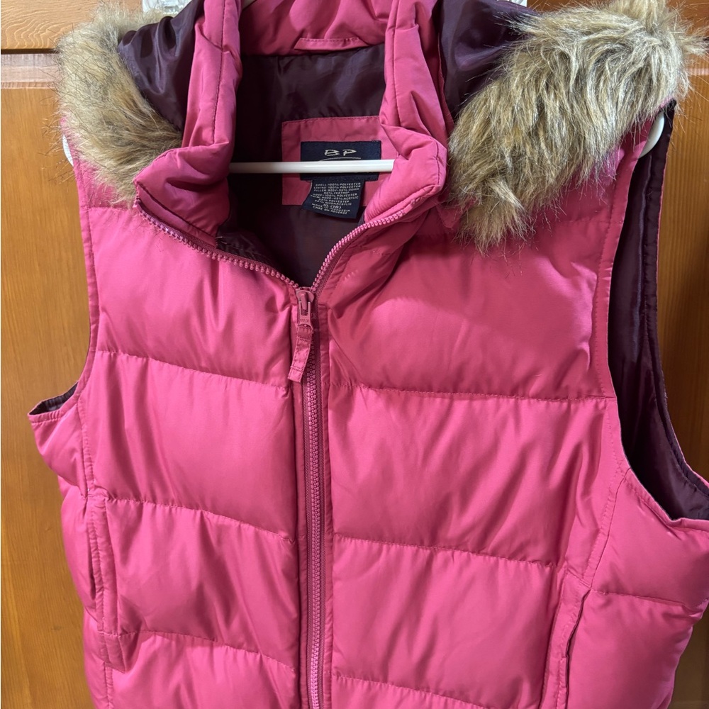 BP down zippered vest with faux fur edged hood, 2 pockets outside and 2 inside.